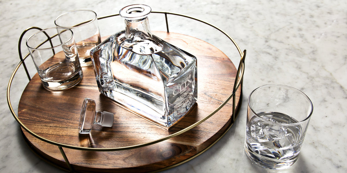 CLIX — the crystal decanter on a serving tray